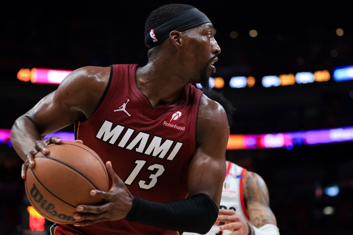 Jan 21, 2025; Miami, Florida, USA; Miami Heat center Bam Adebayo (13) controls the basketball against the Portland Trail Blazers during the second quarter at Kaseya Center. Mandatory Credit: Sam Navarro-Imagn Images