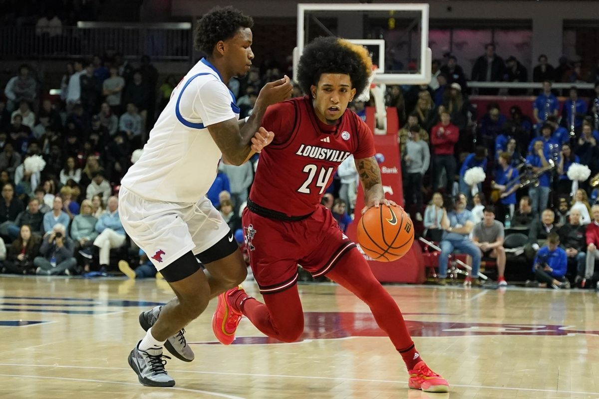 Jan 21, 2025; Dallas, Texas, USA; Louisville Cardinals guard Chucky Hepburn (24) dribbles past SMU Mustangs guard Chuck Harris (3) during the first half at Moody Coliseum. Mandatory Credit: Raymond Carlin III-Imagn Images