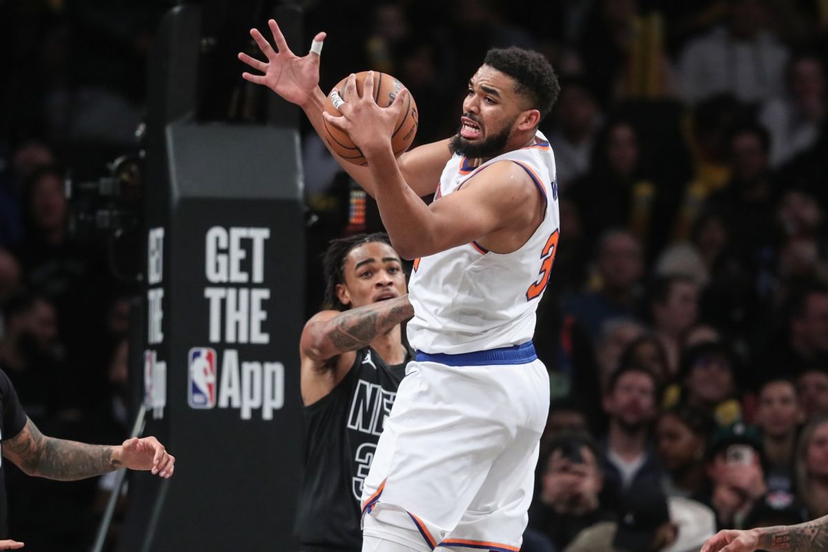 Jan 21, 2025; Brooklyn, New York, USA;  New York Knicks center Karl-Anthony Towns (32) grabs a rebound in the first quarter against the Brooklyn Nets at Barclays Center. Mandatory Credit: Wendell Cruz-Imagn Images