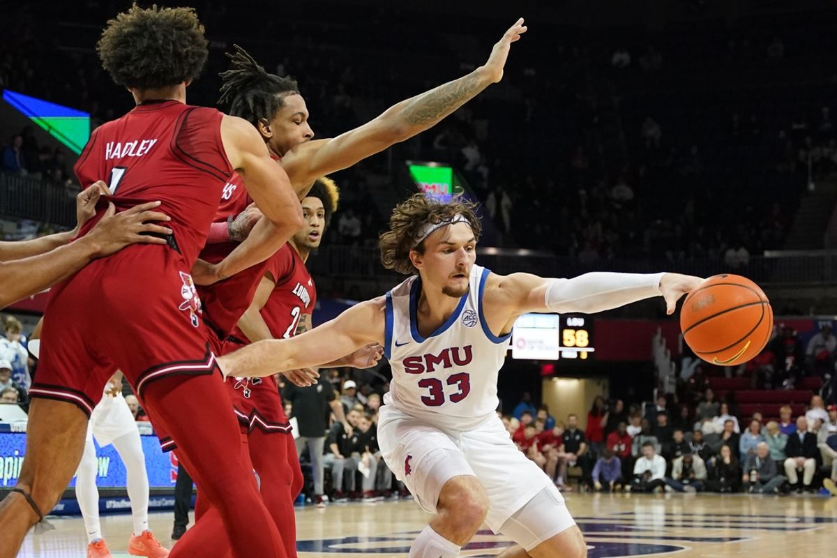 Jan 21, 2025; Dallas, Texas, USA; SMU Mustangs forward Matt Cross (33) reacts for the loose ball against the against the Louisville Cardinals during the second half at Moody Coliseum. Mandatory Credit: Raymond Carlin III-Imagn Images