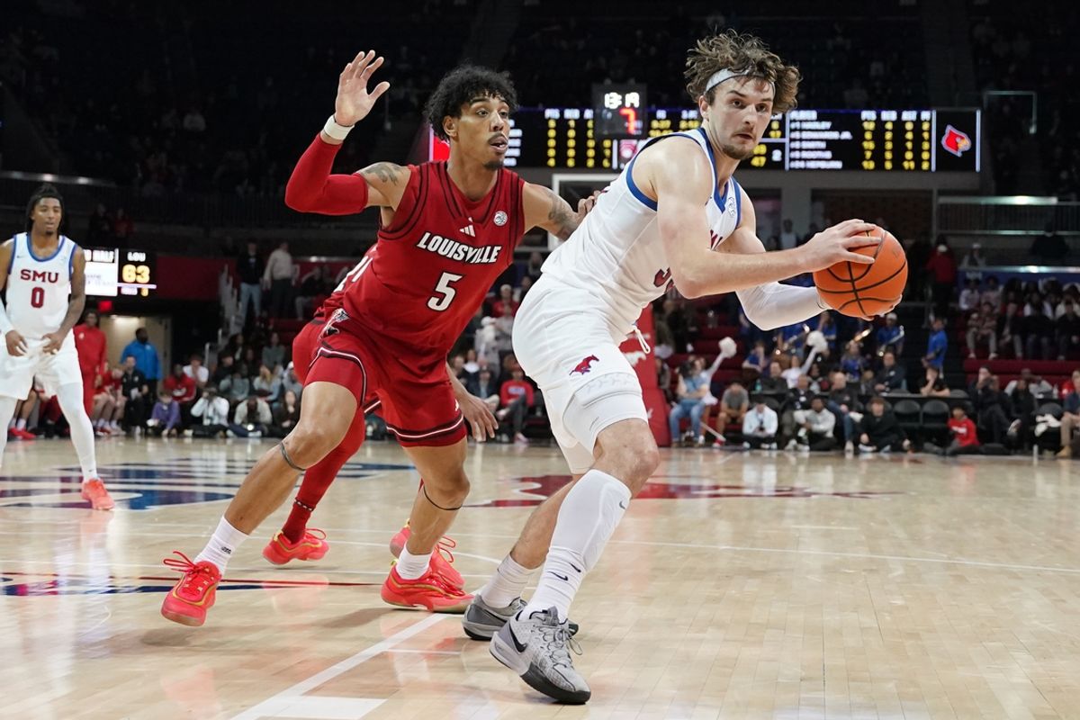 Jan 21, 2025; Dallas, Texas, USA; SMU Mustangs forward Matt Cross (33) is defended by Louisville Cardinals guard Terrence Edwards Jr. (5) during the second half at Moody Coliseum. Mandatory Credit: Raymond Carlin III-Imagn Images