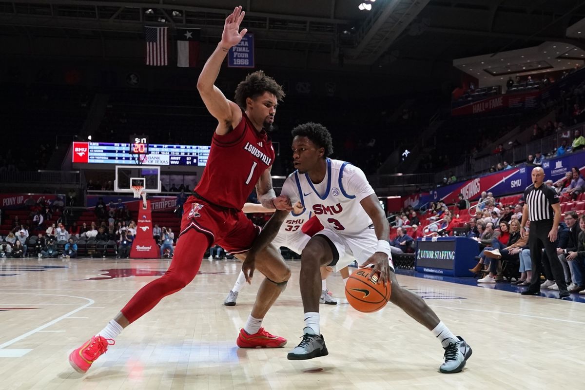 Jan 21, 2025; Dallas, Texas, USA; SMU Mustangs guard Chuck Harris (3) dribbles against the defense of Louisville Cardinals guard J'Vonne Hadley (1) during the second half at Moody Coliseum. Mandatory Credit: Raymond Carlin III-Imagn Images