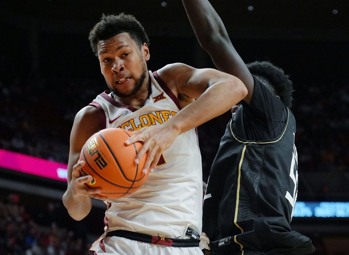 Iowa State Cyclones forward Joshua Jefferson (2) rebounds the ball around UCF Knights forward Moustapha Thiam (52) during the second half in the Big-12 men’s basketball at Hilton Coliseum onTuesday, Jan. 21, 2025 in Ames, Iowa.