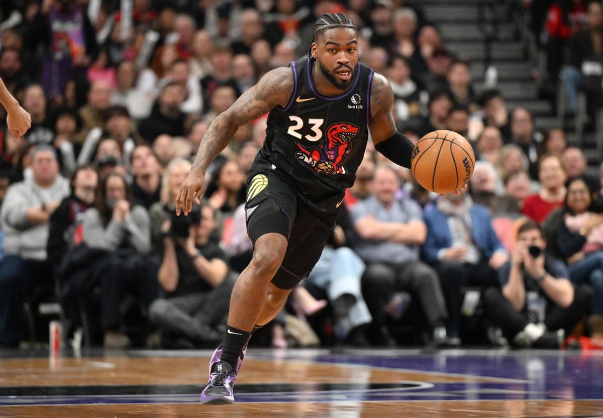 Jan 21, 2025; Toronto, Ontario, CAN;  Toronto Raptors guard Jamal Shead (23) dribbles against the Orlando Magic in the second half at Scotiabank Arena. Mandatory Credit: Dan Hamilton-Imagn Images