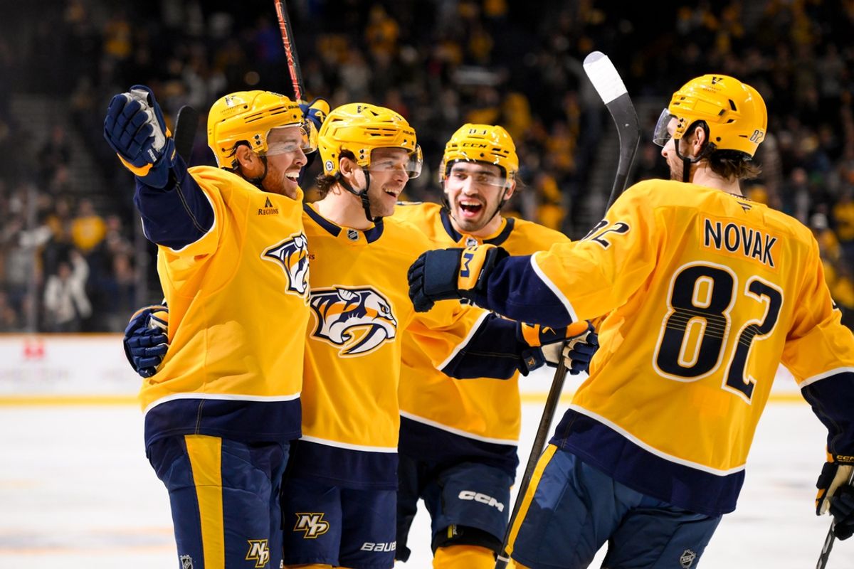 Jan 21, 2025; Nashville, Tennessee, USA;  Nashville Predators defenseman Nick Blankenburg (37) celebrates his goal with his teammates against the San Jose Sharks during the third period at Bridgestone Arena. Mandatory Credit: Steve Roberts-Imagn Images