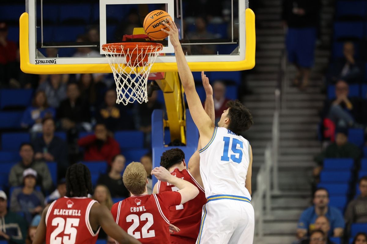 Jan 21, 2025; Los Angeles, California, USA;  UCLA Bruins center Aday Mara (15) dunks the ball during the second half against the Wisconsin Badgers at Pauley Pavilion presented by Wescom. Mandatory Credit: Kiyoshi Mio-Imagn Images