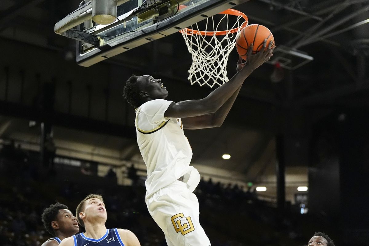 Jan 21, 2025; Boulder, Colorado, USA; Colorado Buffaloes forward Bangot Dak (8) shoots in the second half against the Brigham Young Cougars at CU Events Center. Mandatory Credit: Ron Chenoy-Imagn Images