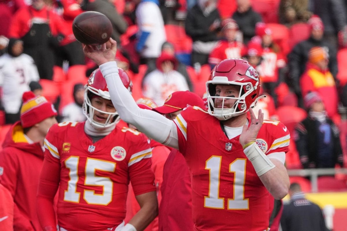 Jan 18, 2025; Kansas City, Missouri, USA; Kansas City Chiefs quarterback Carson Wentz (11) warms up against the Houston Texans prior to a 2025 AFC divisional round game at GEHA Field at Arrowhead Stadium. Mandatory Credit: Denny Medley-Imagn Images