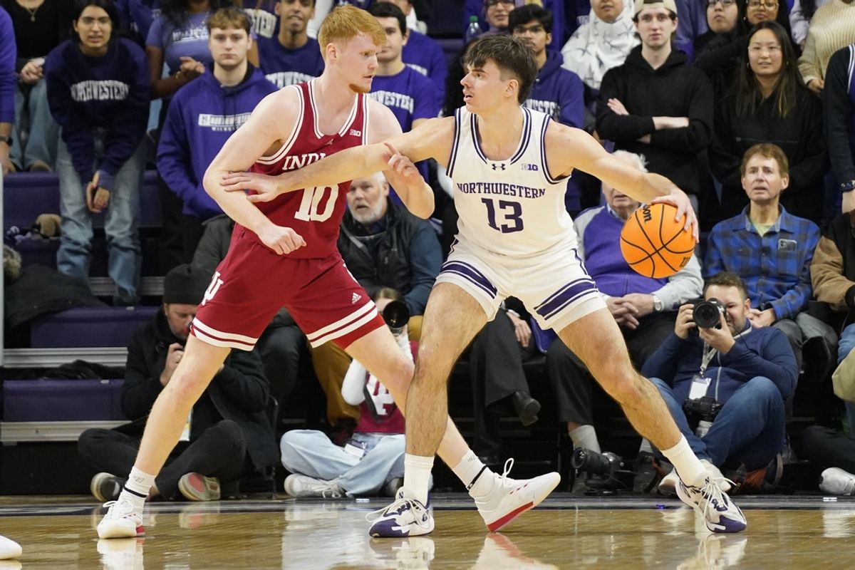 Jan 22, 2025; Evanston, Illinois, USA; Indiana Hoosiers forward Luke Goode (10) defends Northwestern Wildcats guard Brooks Barnhizer (13) during the first half at Welsh-Ryan Arena. Mandatory Credit: David Banks-Imagn Images