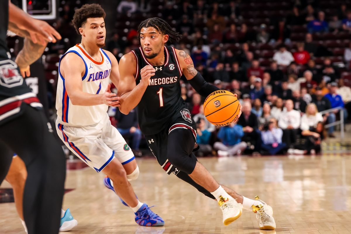 Jan 22, 2025; Columbia, South Carolina, USA; South Carolina Gamecocks guard Jacobi Wright (1) drives around Florida Gators guard Walter Clayton Jr. (1) in the first half at Colonial Life Arena. Mandatory Credit: Jeff Blake-Imagn Images