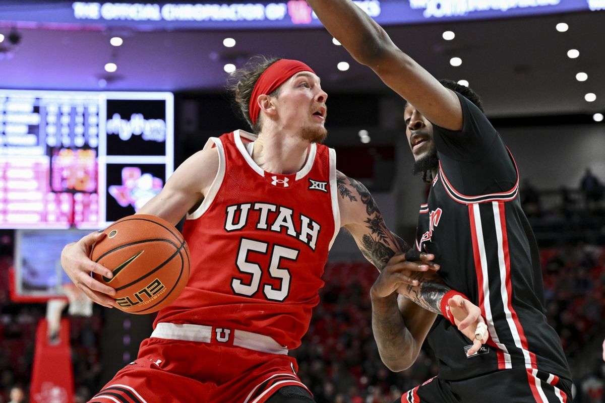 Jan 22, 2025; Houston, Texas, USA; Utah Utes guard Gabe Madsen (55) drives against Houston Cougars forward Ja'Vier Francis (5) during the second half at Fertitta Center. The Cougars defeated the Utes 70-36. Mandatory Credit: Maria Lysaker-Imagn Images