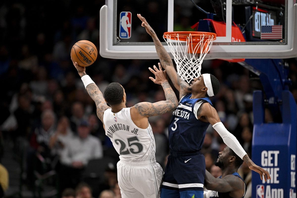 Jan 22, 2025; Dallas, Texas, USA; Dallas Mavericks forward P.J. Washington (25) attempts a shot by Minnesota Timberwolves forward Jaden McDaniels (3) during the first half at the American Airlines Center. Mandatory Credit: Jerome Miron-Imagn Images