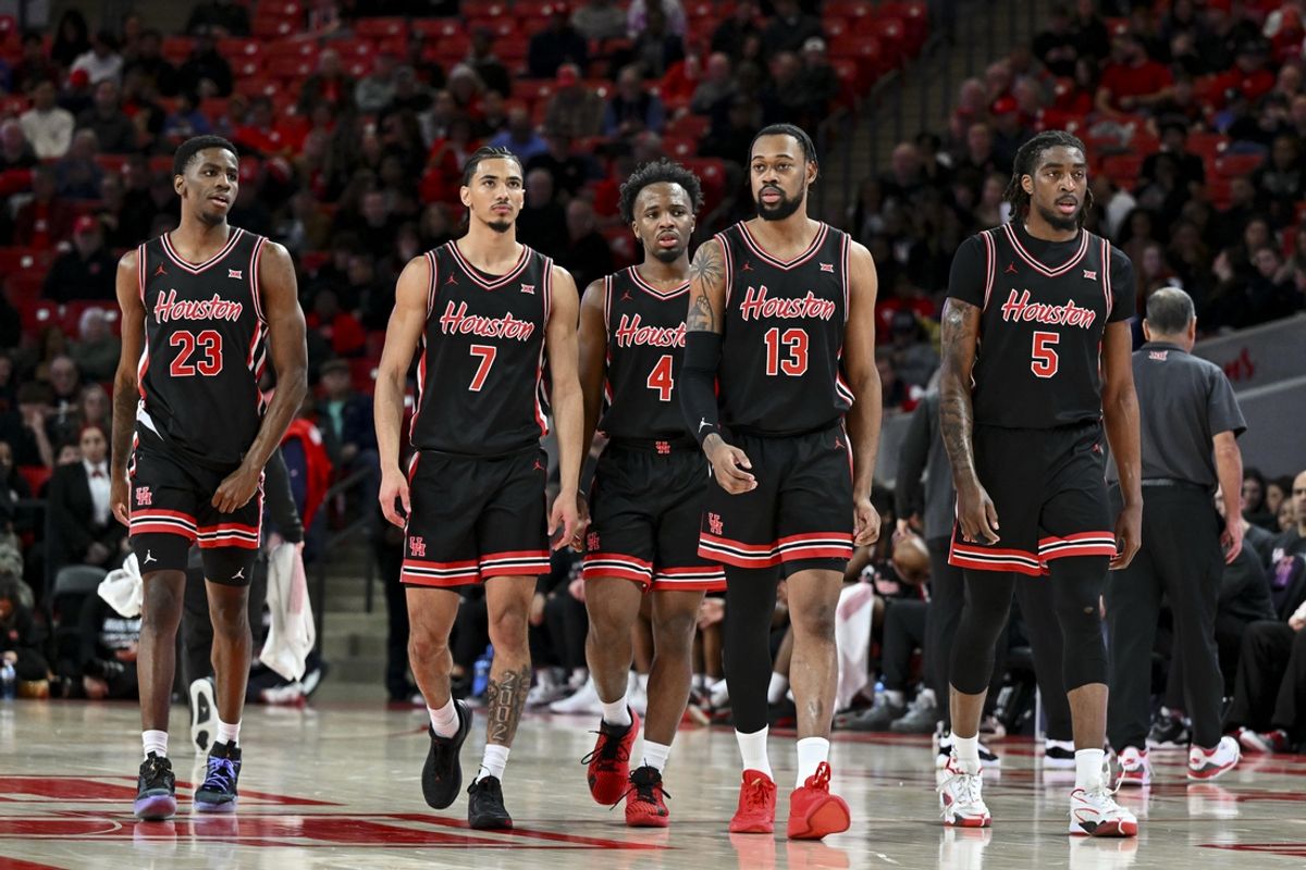 Jan 22, 2025; Houston, Texas, USA; Houston Cougars guard Terrance Arceneaux (23), guard Milos Uzan (7), guard L.J. Cryer (4), forward J'Wan Roberts (13) and forward Ja'Vier Francis (5) walk on the court after a time-out in the second half against the Utah Utes at Fertitta Center. The Cougars defeated the Utes 70-36. Mandatory Credit: Maria Lysaker-Imagn Images