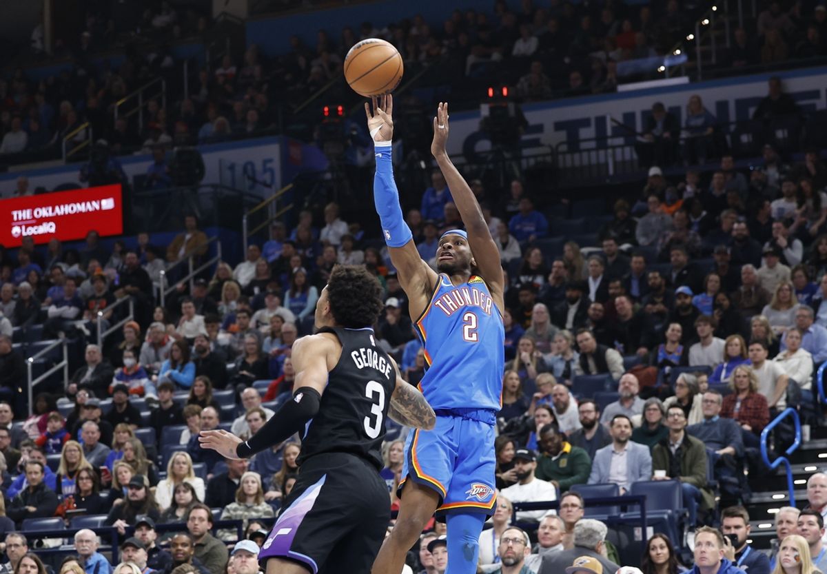 Jan 22, 2025; Oklahoma City, Oklahoma, USA; Oklahoma City Thunder guard Shai Gilgeous-Alexander (2) shoots over Utah Jazz guard Keyonte George (3) during the second quarter at Paycom Center. Mandatory Credit: Alonzo Adams-Imagn Images