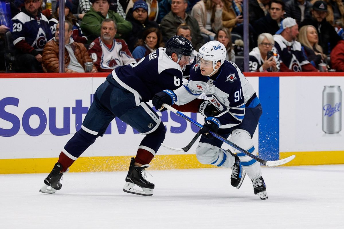 Jan 22, 2025; Denver, Colorado, USA; Colorado Avalanche defenseman Cale Makar (8) and Winnipeg Jets center Cole Perfetti (91) battle for position in the first period at Ball Arena. Mandatory Credit: Isaiah J. Downing-Imagn Images