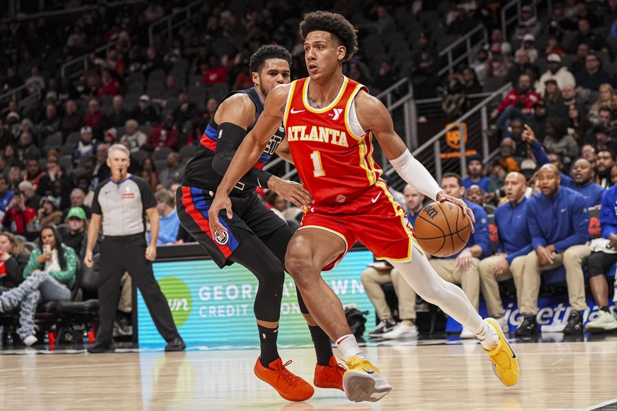 Jan 22, 2025; Atlanta, Georgia, USA; Atlanta Hawks forward Jalen Johnson (1) dribbles past Detroit Pistons forward Tobias Harris (12) during the second half at State Farm Arena. Mandatory Credit: Dale Zanine-Imagn Images