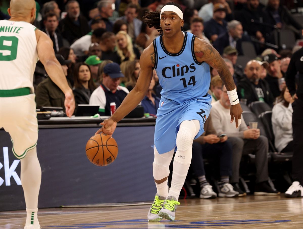 Jan 22, 2025; Inglewood, California, USA; LA Clippers guard Terance Mann (14) dribbles during the first quarter against the Boston Celtics at Intuit Dome. Mandatory Credit: Jason Parkhurst-Imagn Images