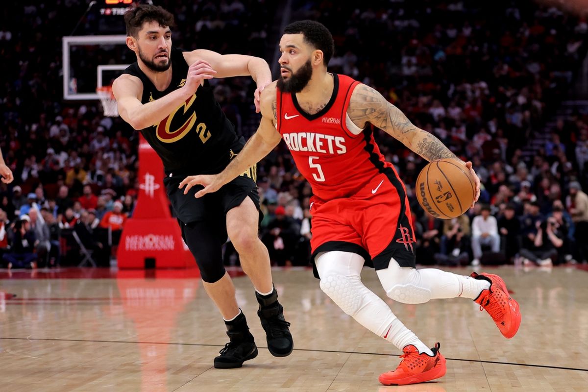 Jan 22, 2025; Houston, Texas, USA; Houston Rockets guard Fred VanVleet (5) handles the ball against Cleveland Cavaliers guard Ty Jerome (2) during the third quarter at Toyota Center. Mandatory Credit: Erik Williams-Imagn Images
