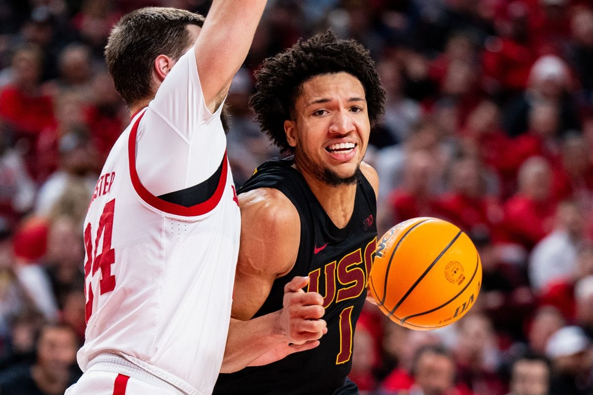 Jan 22, 2025; Lincoln, Nebraska, USA; Southern California Trojans guard Desmond Claude (1) drives against Nebraska Cornhuskers guard Rollie Worster (24) during the second half at Pinnacle Bank Arena. Mandatory Credit: Dylan Widger-Imagn Images