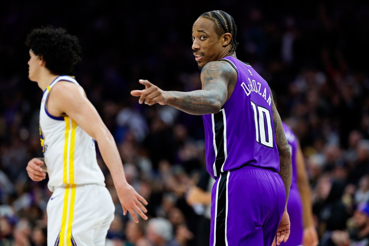 Jan 22, 2025; Sacramento, California, USA; Sacramento Kings forward DeMar DeRozan (10) points towards the Golden State Warriors bench during the fourth quarter at Golden 1 Center. Mandatory Credit: Sergio Estrada-Imagn Images