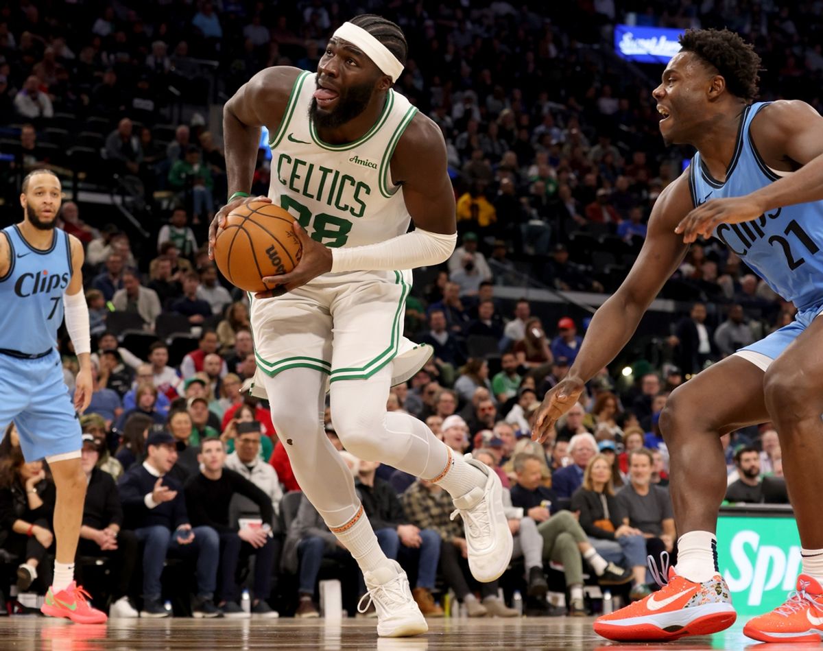 Jan 22, 2025; Inglewood, California, USA; Boston Celtics center Neemias Queta (88) drives against LA Clippers guard Kobe Brown (21) during the third quarter at Intuit Dome. Mandatory Credit: Jason Parkhurst-Imagn Images