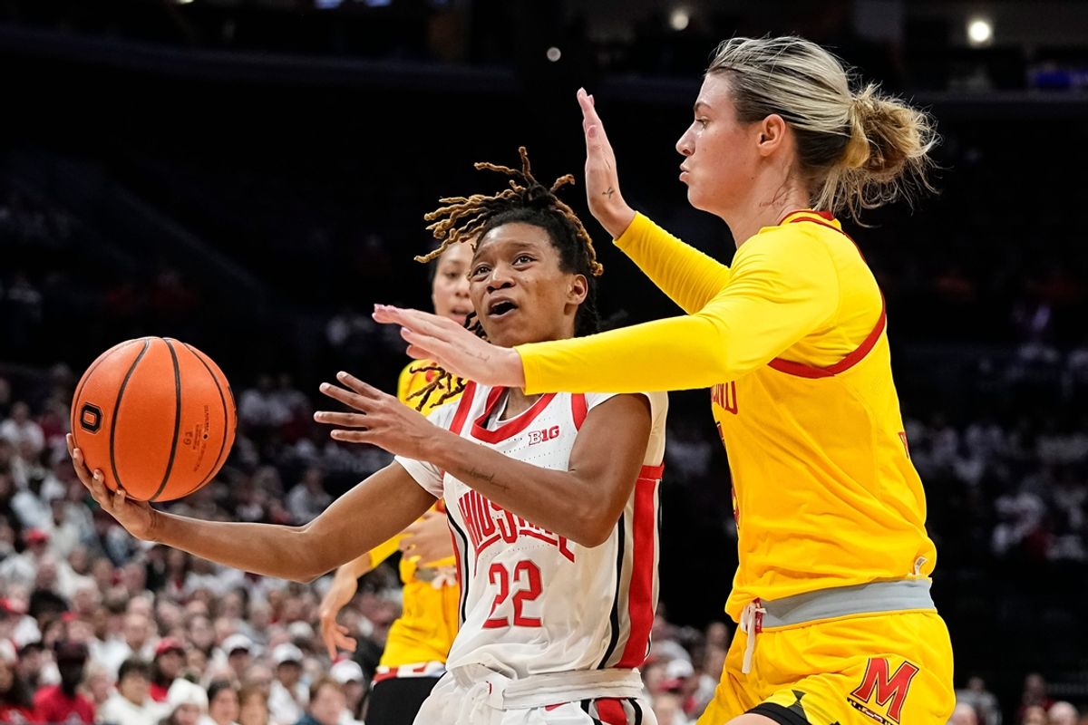 Ohio State Buckeyes guard Jaloni Cambridge (22) drives past Maryland Terrapins guard Saylor Poffenbarger (6) during the first half of the NCAA women's basketball game at Value City Arena on Jan. 23, 2025.