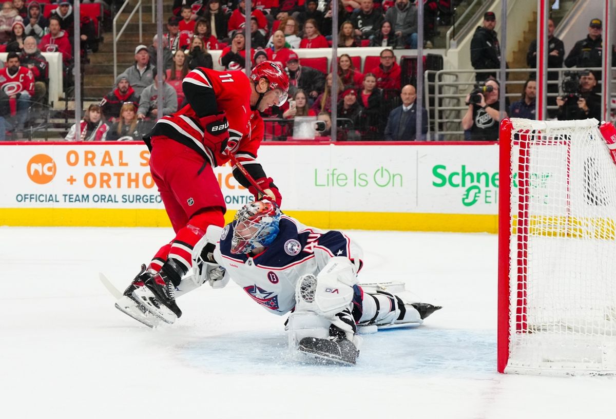 Jan 23, 2025; Raleigh, North Carolina, USA;  Carolina Hurricanes center Jordan Staal (11) scoring attempt is stopped by Columbus Blue Jackets goaltender Daniil Tarasov (40) during the first period at Lenovo Center. Mandatory Credit: James Guillory-Imagn Images