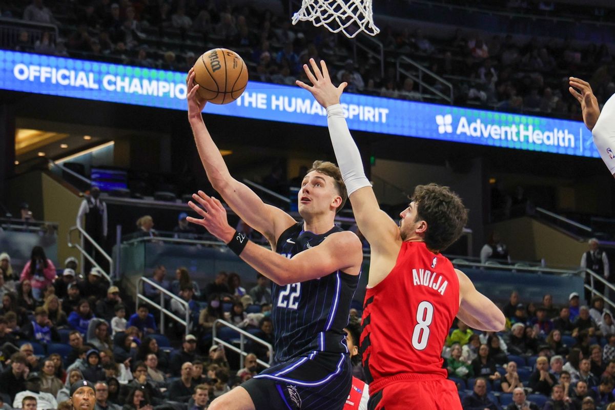 Jan 23, 2025; Orlando, Florida, USA; Orlando Magic forward Franz Wagner (22) goes to the basket against Portland Trail Blazers forward Deni Avdija (8) during the second quarter at Kia Center. Mandatory Credit: Mike Watters-Imagn Images