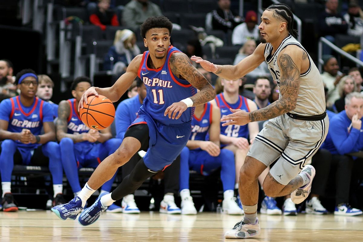 Jan 17, 2025; Washington, District of Columbia, USA; DePaul Blue Demons guard CJ Gunn (11) drives past Georgetown Hoyas guard Micah Peavy (5) during the second half at Capital One Arena. Mandatory Credit: Daniel Kucin Jr.-Imagn Images