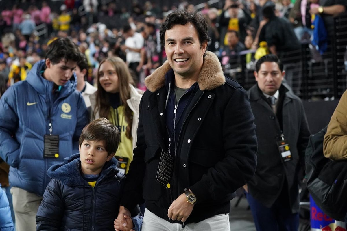 Jan 18, 2025; Las Vegas, Nevada, USA;  Former Formula 1 driver Sergio Perez enters the field as a guest of Club America prior to America's match against Inter Miami CF at Allegiant Stadium. Mandatory Credit: David Gonzales-Imagn Images