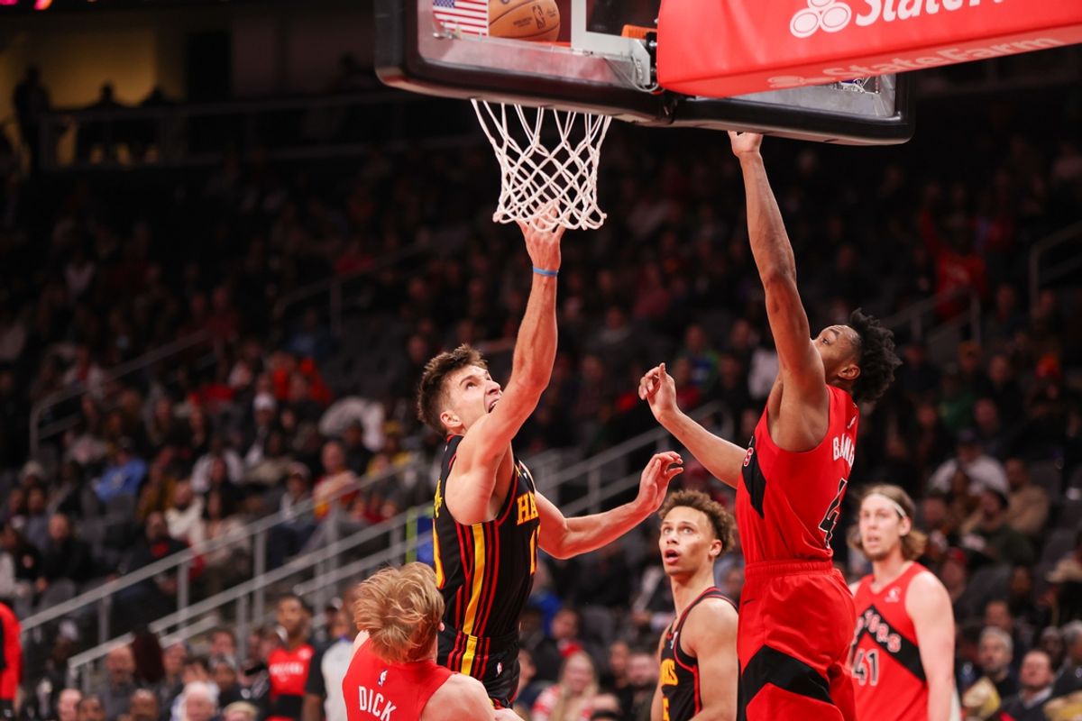 Jan 23, 2025; Atlanta, Georgia, USA; Atlanta Hawks guard Bogdan Bogdanovic (13) shoots against the Toronto Raptors in the second quarter at State Farm Arena. Mandatory Credit: Brett Davis-Imagn Images