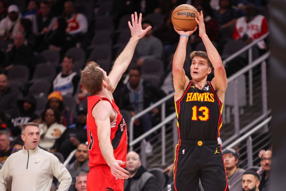 Jan 23, 2025; Atlanta, Georgia, USA; Atlanta Hawks guard Bogdan Bogdanovic (13) shoots against the Toronto Raptors in the second quarter at State Farm Arena. Mandatory Credit: Brett Davis-Imagn Images