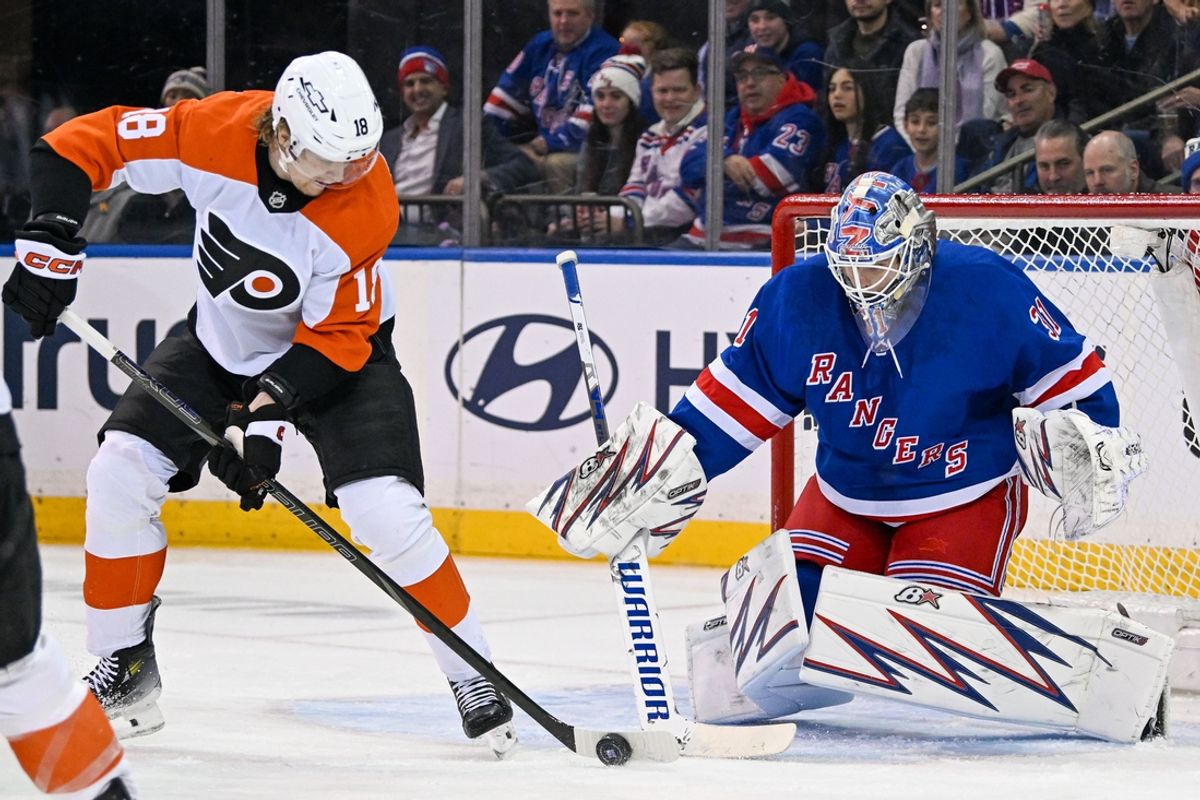 Jan 23, 2025; New York, New York, USA;  Philadelphia Flyers center Rodrigo Abols (18) plays the puck infant of New York Rangers goaltender Igor Shesterkin (31) during the second period at Madison Square Garden. Mandatory Credit: Dennis Schneidler-Imagn Images
