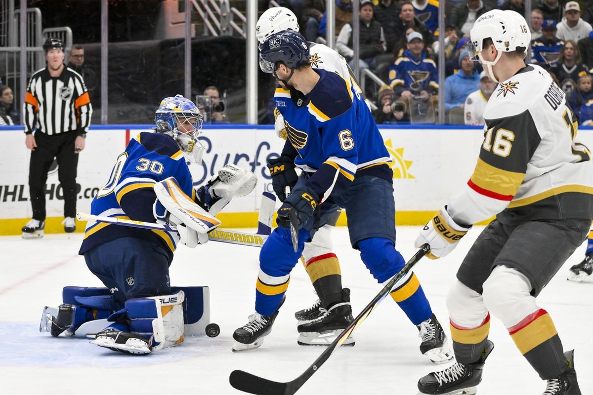 Jan 23, 2025; St. Louis, Missouri, USA;  St. Louis Blues goaltender Joel Hofer (30) defends the net against the Vegas Golden Knights during the first period at Enterprise Center. Mandatory Credit: Jeff Curry-Imagn Images
