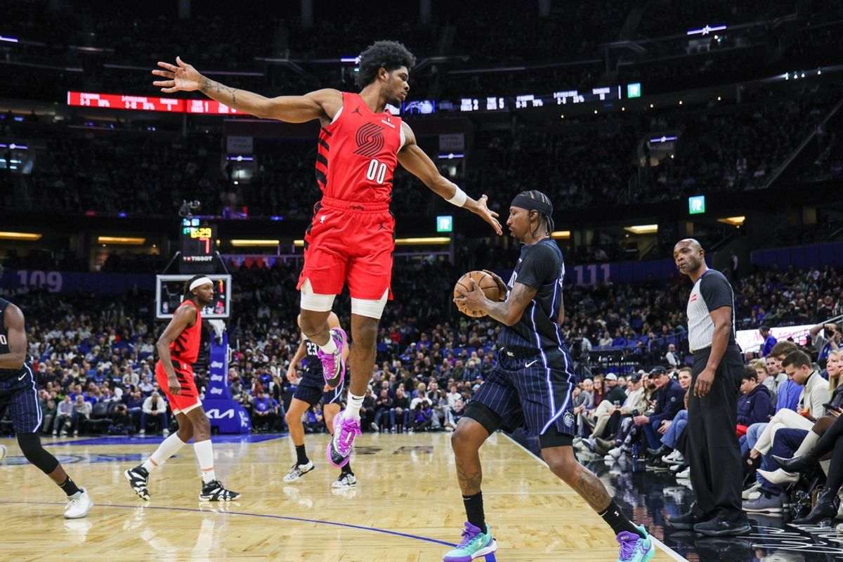 Jan 23, 2025; Orlando, Florida, USA; Orlando Magic guard Kentavious Caldwell-Pope (3) is fouled by Portland Trail Blazers guard Scoot Henderson (00) during the second quarter at Kia Center. Mandatory Credit: Mike Watters-Imagn Images