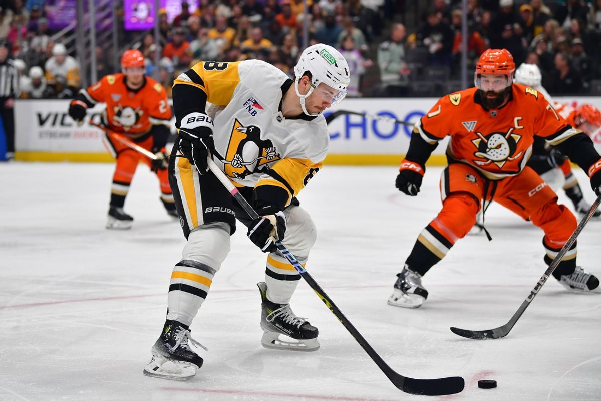 Jan 23, 2025; Anaheim, California, USA; Pittsburgh Penguins left wing Michael Bunting (8) moves the puck against the Anaheim Ducks during the second period at Honda Center. Mandatory Credit: Gary A. Vasquez-Imagn Images
