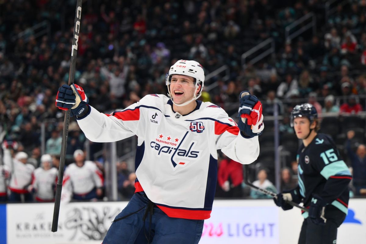 Jan 23, 2025; Seattle, Washington, USA; Washington Capitals center Aliaksei Protas (21) celebrates after scoring a goal against the Seattle Kraken during the second period at Climate Pledge Arena. Mandatory Credit: Steven Bisig-Imagn Images