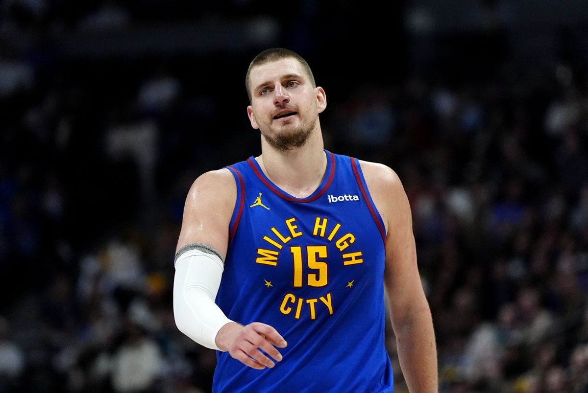 Jan 23, 2025; Denver, Colorado, USA; Denver Nuggets center Nikola Jokic (15) reacts after a foul in the second half against the Sacramento Kings at Ball Arena. Mandatory Credit: Ron Chenoy-Imagn Images