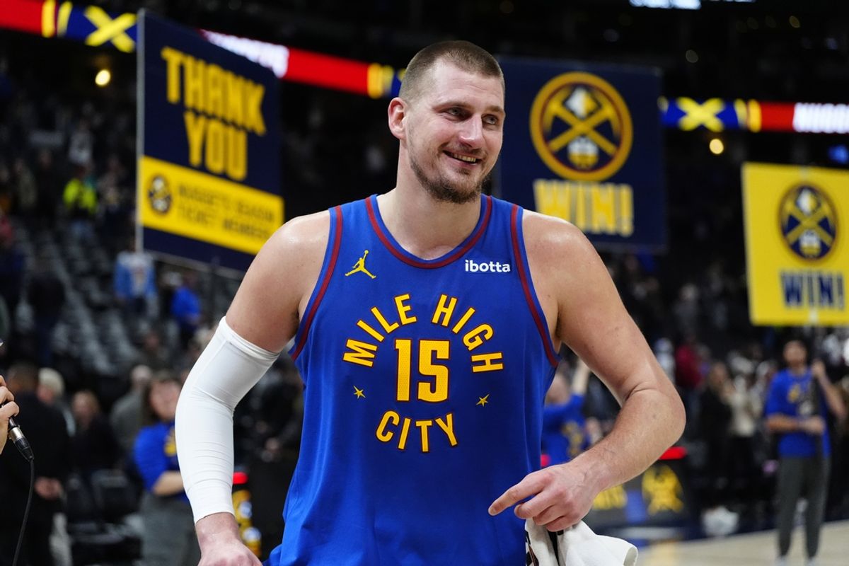 Jan 23, 2025; Denver, Colorado, USA; Denver Nuggets center Nikola Jokic (15) reacts following the win over Sacramento Kings at Ball Arena. Mandatory Credit: Ron Chenoy-Imagn Images