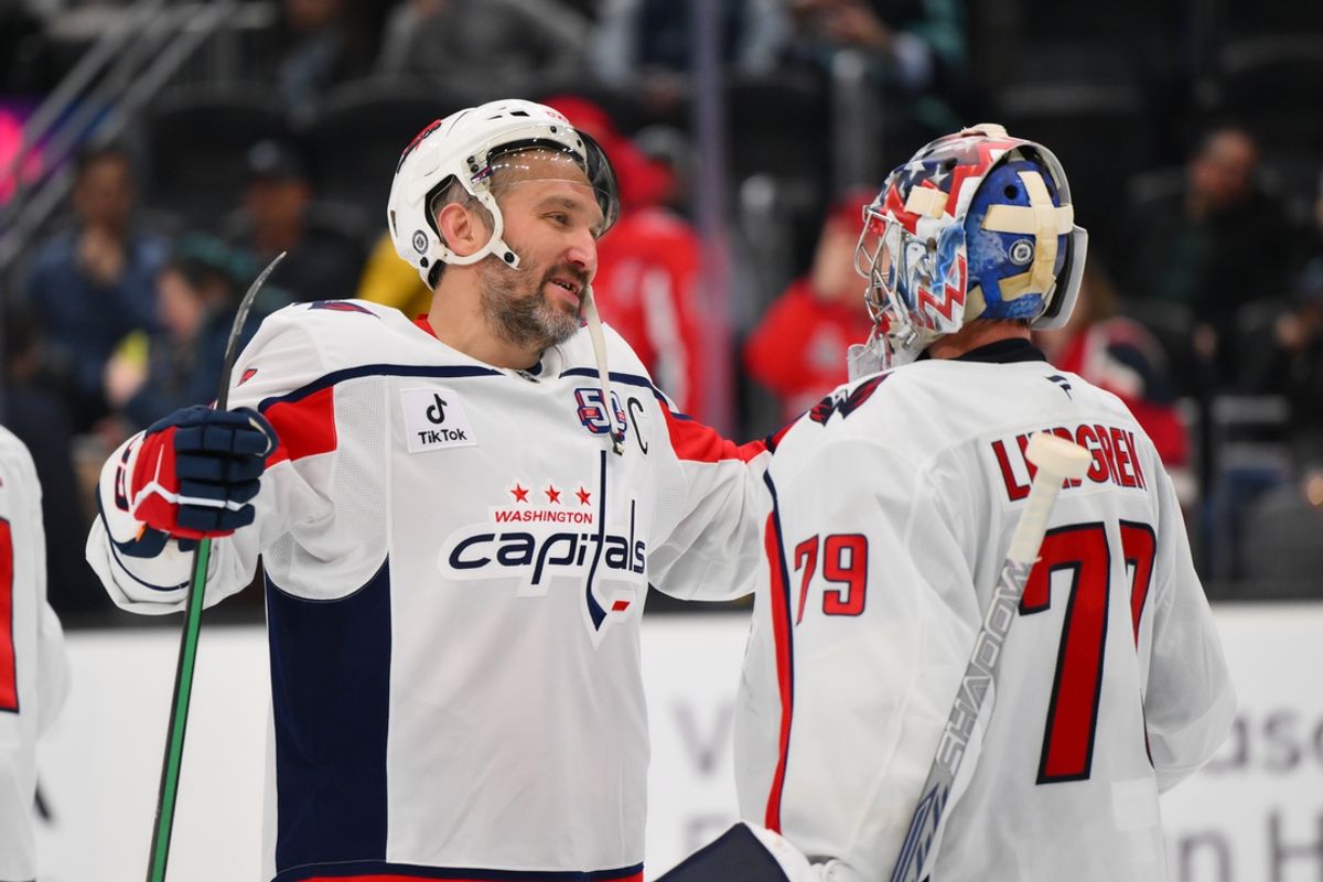 Jan 23, 2025; Seattle, Washington, USA; Washington Capitals left wing Alex Ovechkin (8) and goaltender Charlie Lindgren (79) celebrate defeating the Seattle Kraken at Climate Pledge Arena. Mandatory Credit: Steven Bisig-Imagn Images