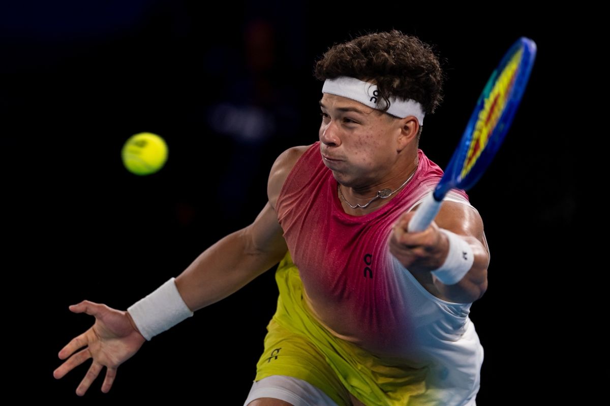 Jan 24, 2025; Melbourne, Victoria, Australia; Ben Shelton of United States of America hits a forehand during his match against Jannik Sinner of Italy in the semifinals of the men's singles at the 2025 Australian Open at Melbourne Park. Mandatory Credit: Mike Frey-Imagn Images