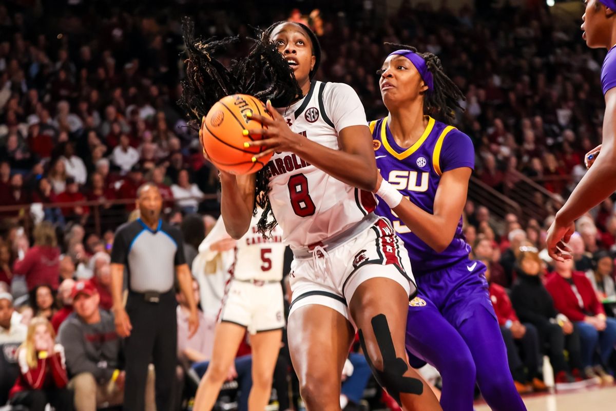Jan 24, 2025; Columbia, South Carolina, USA; South Carolina Gamecocks forward Joyce Edwards (8) drives past LSU Lady Tigers forward Sa'Myah Smith (5) in the first half at Colonial Life Arena. Mandatory Credit: Jeff Blake-Imagn Images