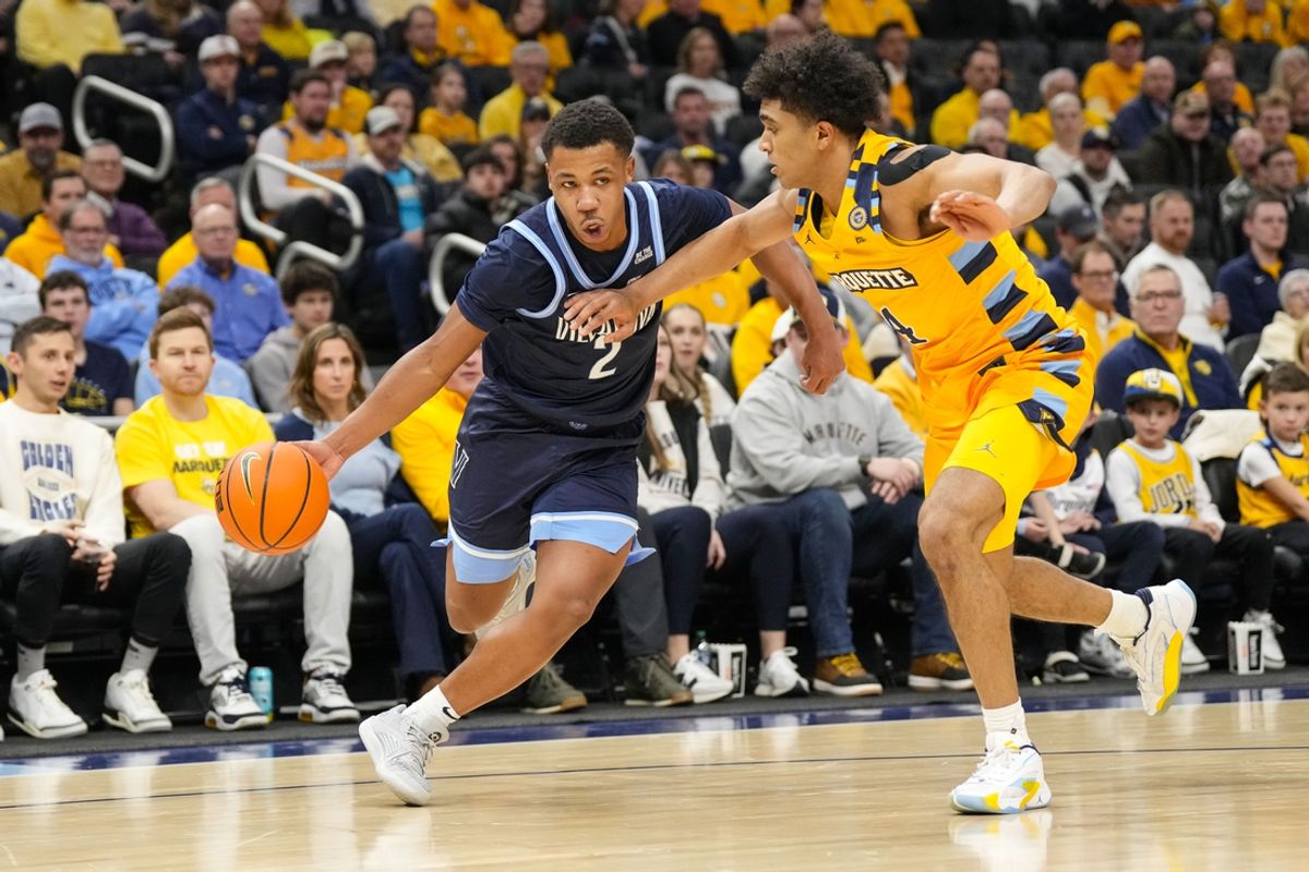 Jan 24, 2025; Milwaukee, Wisconsin, USA;  Villanova Wildcats guard Jhamir Brickus (2) drives for the basket against Marquette Golden Eagles guard Stevie Mitchell (4) during the first half at Fiserv Forum. Mandatory Credit: Jeff Hanisch-Imagn Images