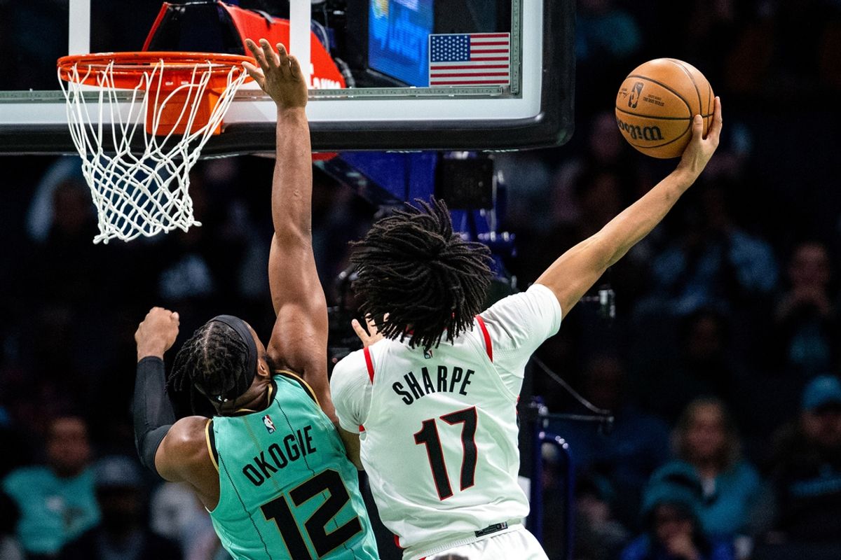 Jan 24, 2025; Charlotte, North Carolina, USA; Portland Trail Blazers guard Shaedon Sharpe (17) shoots on Charlotte Hornets forward Josh Okogie (12) during the second quarter of at Spectrum Center. Mandatory Credit: Scott Kinser-Imagn Images