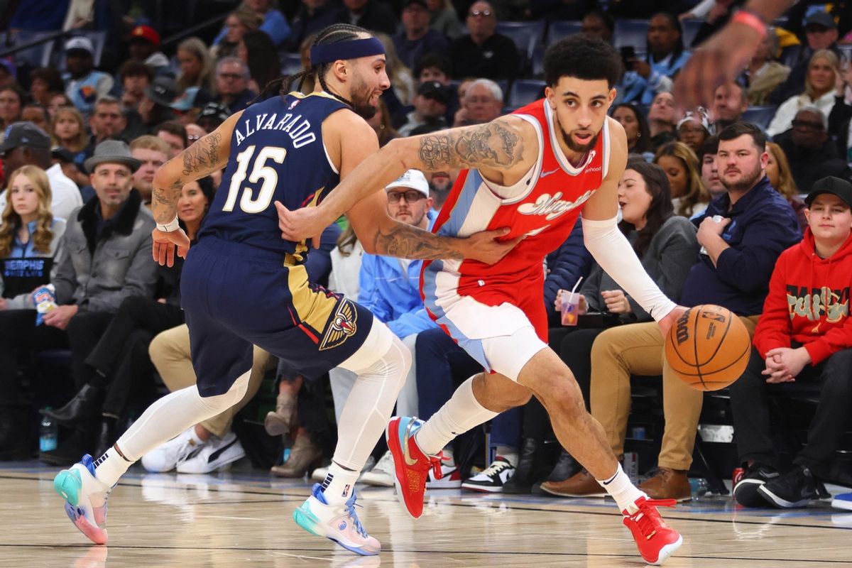 Jan 24, 2025; Memphis, Tennessee, USA; Memphis Grizzlies guard Scotty Pippen Jr. (1) dribbles past New Orleans Pelicans guard Jose Alvarado (15) during the second quarter at FedExForum. Mandatory Credit: Petre Thomas-Imagn Images