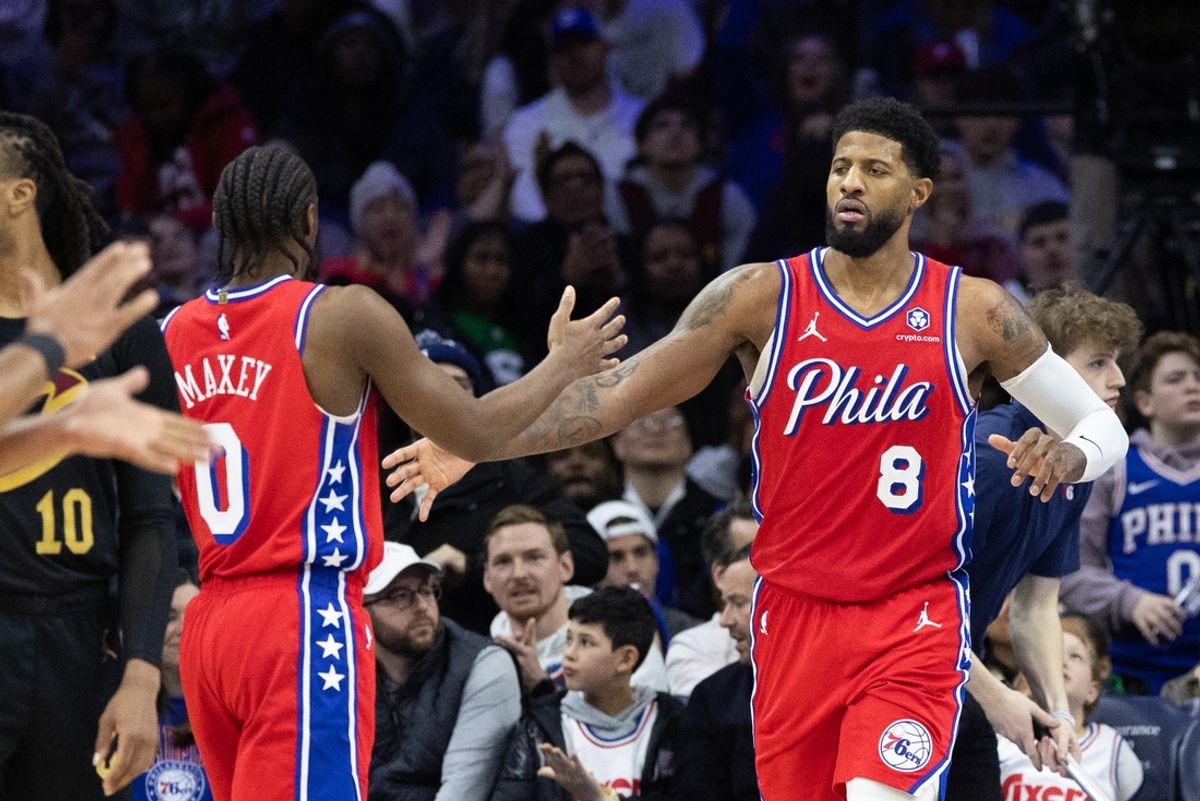 Jan 24, 2025; Philadelphia, Pennsylvania, USA; Philadelphia 76ers forward Paul George (8) high fives guard Tyrese Maxey (0) after scoring during the fourth quarter against the Cleveland Cavaliers at Wells Fargo Center. Mandatory Credit: Bill Streicher-Imagn Images