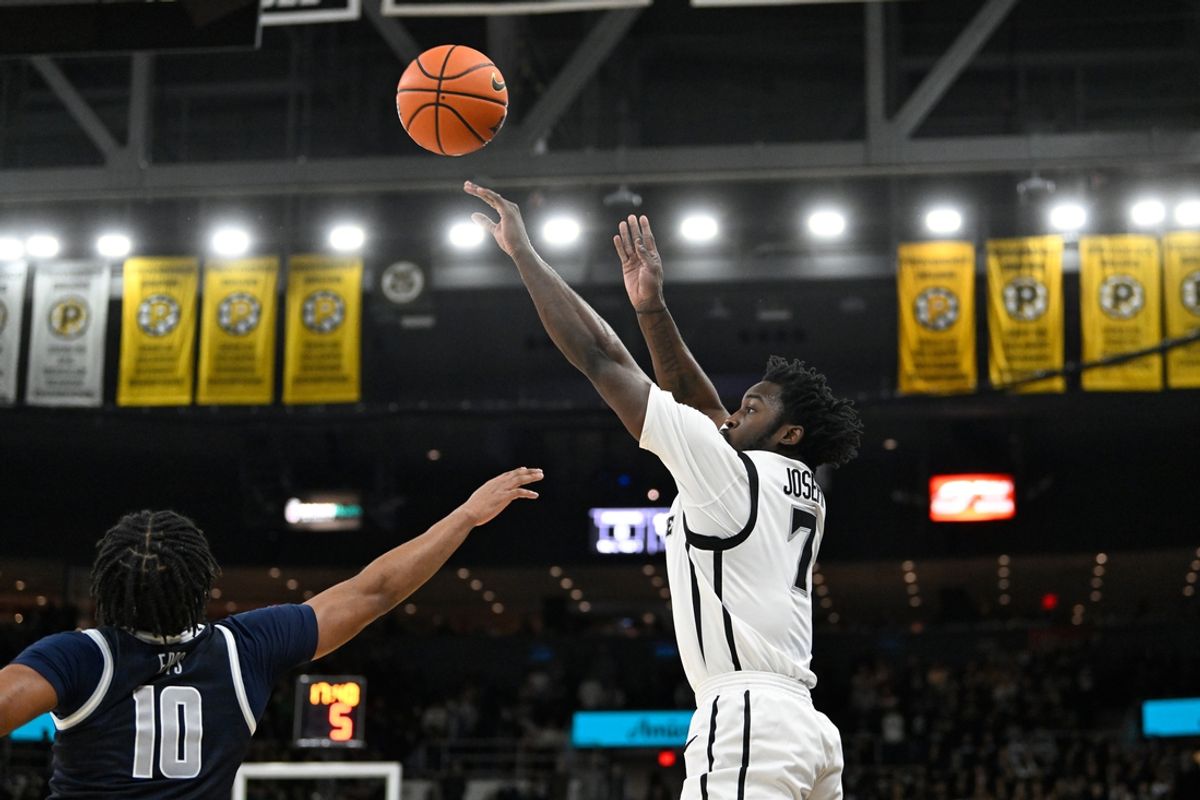 Jan 25, 2025; Providence, Rhode Island, USA; Providence Friars guard Bensley Joseph (7) shoots for three points over Georgetown Hoyas guard Jayden Epps (10) during the first half at Amica Mutual Pavilion. Mandatory Credit: Eric Canha-Imagn Images