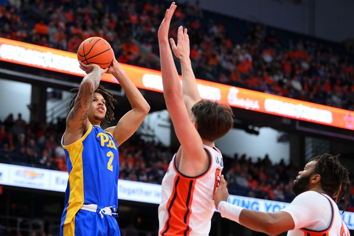 Jan 25, 2025; Syracuse, New York, USA; Pittsburgh Panthers forward Cameron Corhen (2) shoots against Syracuse Orange forward Petar Majstorovic (6) and center Eddie Lampkin Jr. (44) during the first half at the JMA Wireless Dome. Mandatory Credit: Rich Barnes-Imagn Images