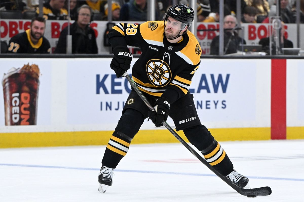 Jan 25, 2025; Boston, Massachusetts, USA; Boston Bruins center Elias Lindholm (28) takes a shot against the Colorado Avalanche during the first period at the TD Garden. Mandatory Credit: Brian Fluharty-Imagn Images