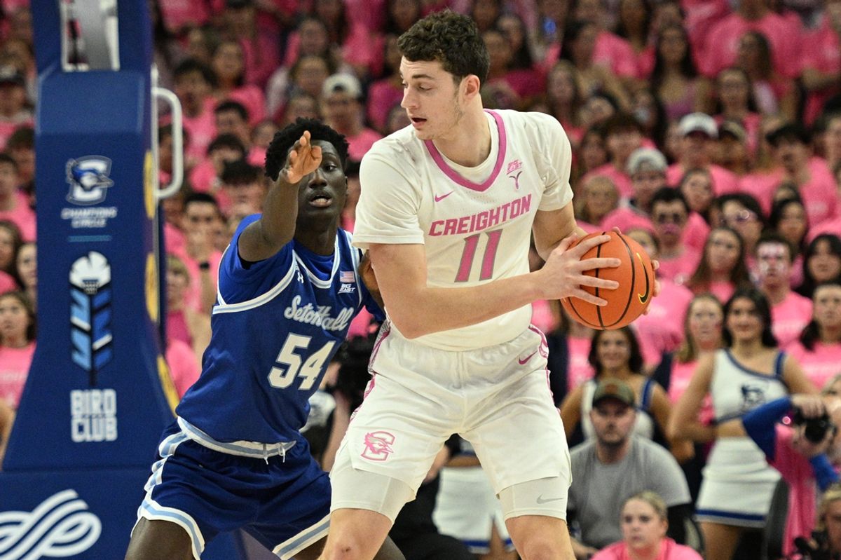 Jan 25, 2025; Omaha, Nebraska, USA;  Creighton Bluejays center Ryan Kalkbrenner (11) backs in against Seton Hall Pirates center Godswill Erheriene (54) during the first half at CHI Health Center Omaha. Mandatory Credit: Steven Branscombe-Imagn Images